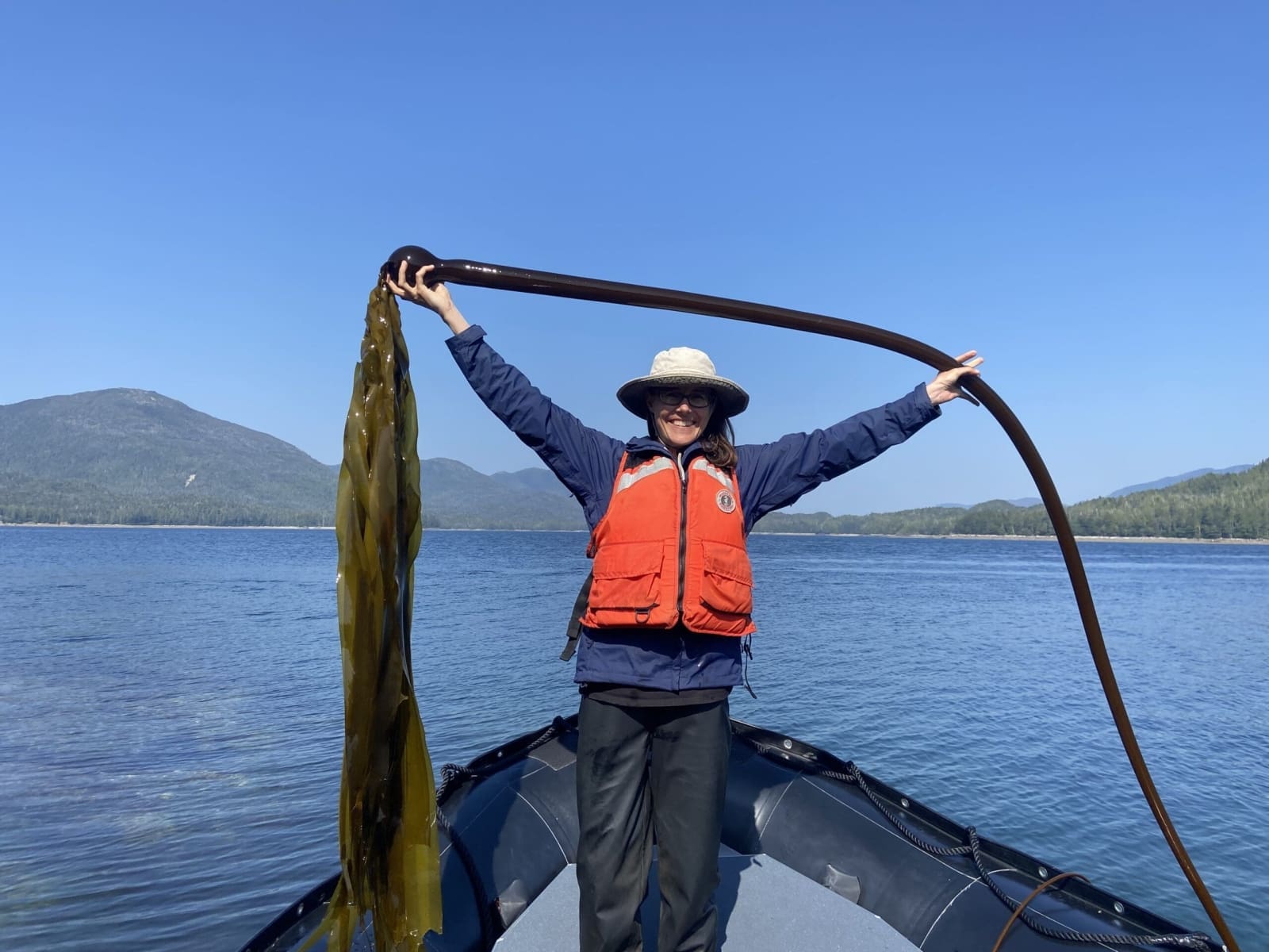 Naturalist holding a large piece of Bull Kelp