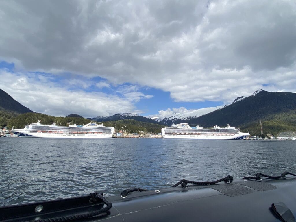 Two cruise ships docked in downtown Ketchikan viewed from a Zodiac